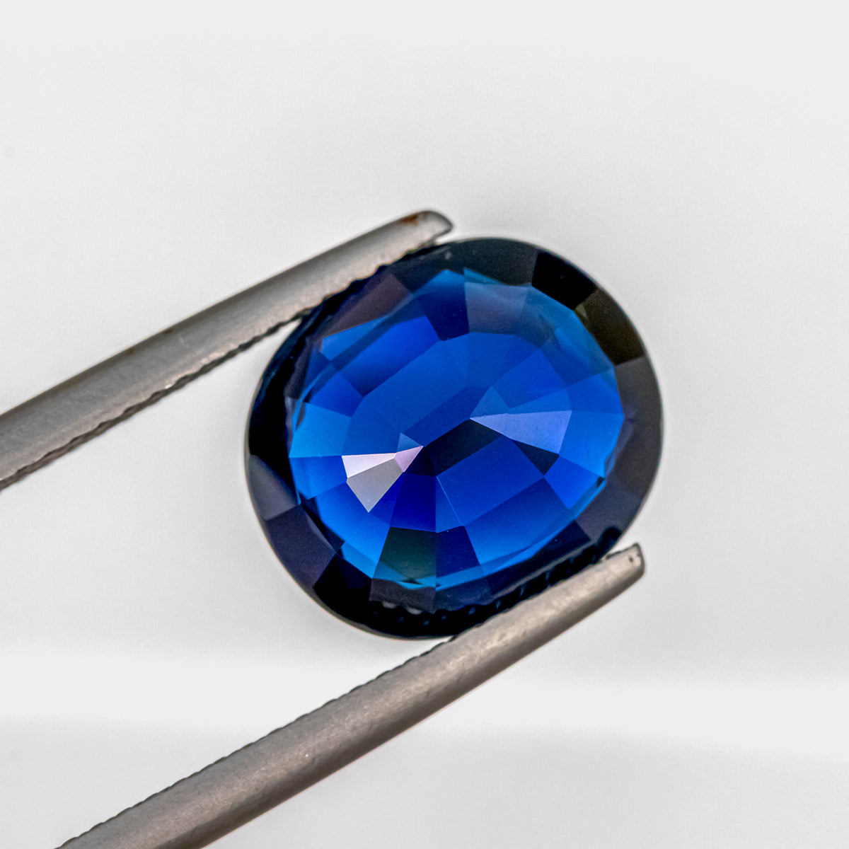 Deep Blue Sapphire 6.25 CT 11.89x10.40x5.69 MM Oval Cut Unheated GRS C