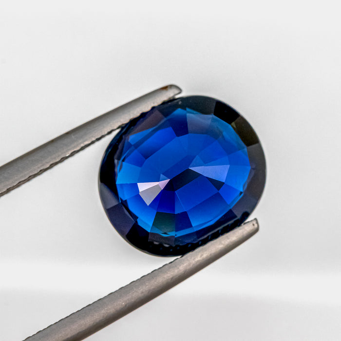 Deep Blue Sapphire 6.25 CT 11.89x10.40x5.69 MM Oval Cut Unheated GRS C